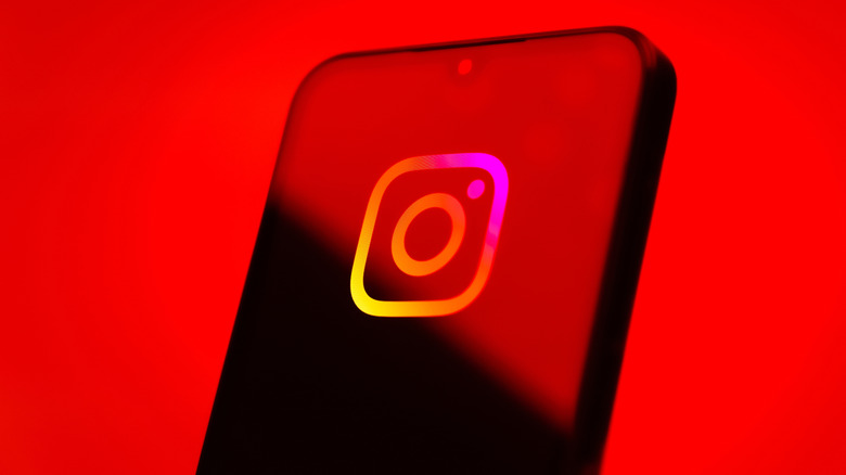 The Instagram logo on a phone screen.