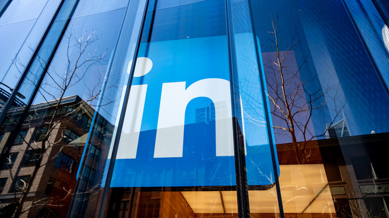 LinkedIn logo inside an office building's windows