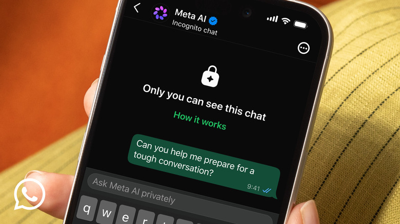 A person holds a phone displaying a private chat with the Meta AI chatbot in WhatsApp. It says 