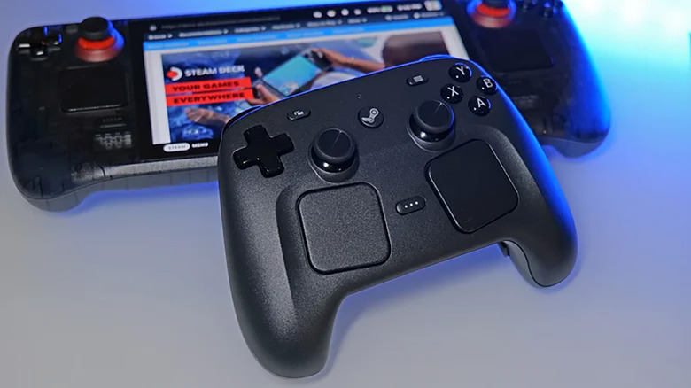 A Steam Controller leaning against a Steam Deck